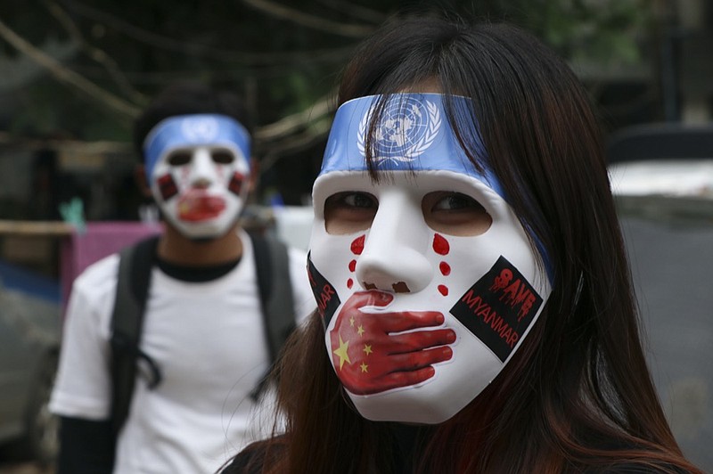 FILE - A young demonstrators participate in an anti-coup mask strike in Yangon, Myanmar, on April 4, 2021.  (AP Photo, File)


