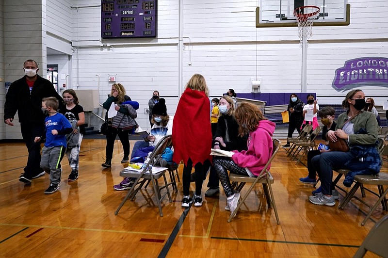 Children wait with their parents after being administered the Pfizer COVID-19 vaccine during a vaccination clinic for ages 5 - 11 hosted by Jewel Osco in Wheeling, Ill., Wednesday, Nov. 17, 2021. (AP Photo/Nam Y. Huh)


