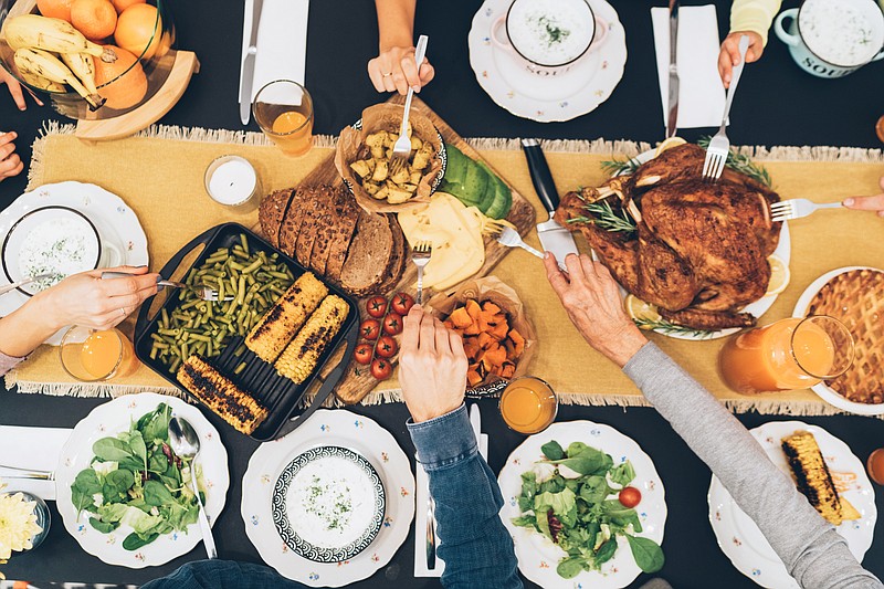 Getty Images / thanksgiving family dinner tile