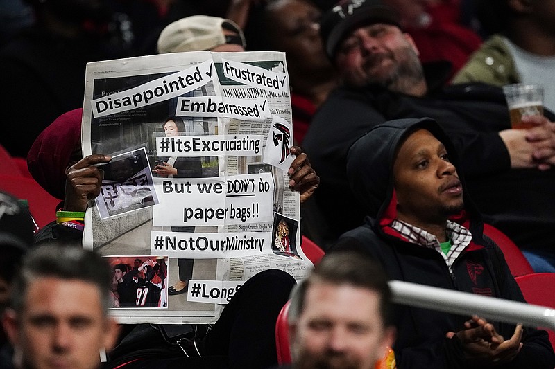 AP photo by John Bazemore / An Atlanta Falcons fan shows his frustration with the team during Thursday night's shutout loss to the visiting New England Patriots. Atlanta lost 25-0 four days after a 43-3 road loss to the Dallas Cowboys.