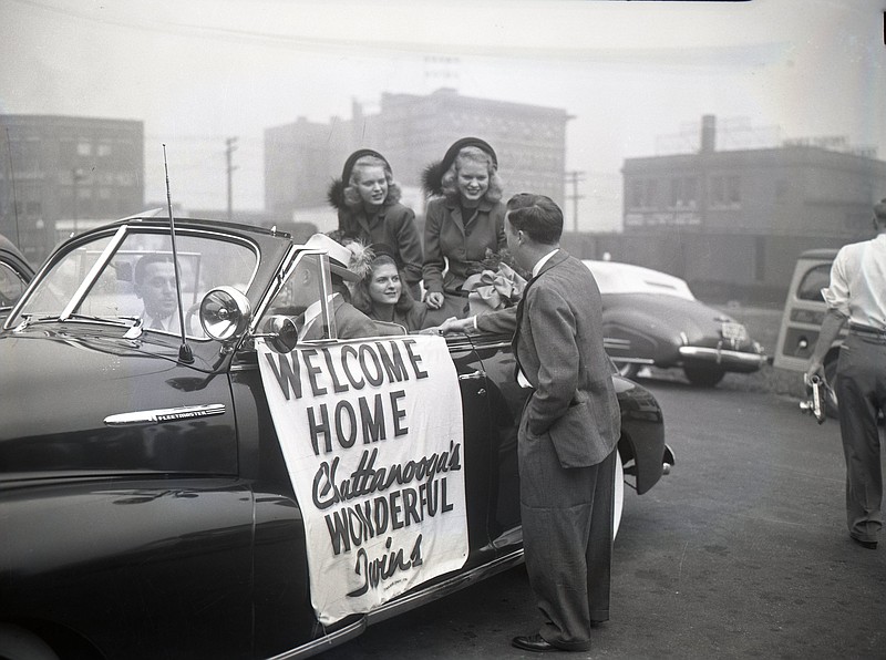 Jean and Jane Cunningham, identical twins, sit in the back of a Chevrolet convertible in this 1947 photo preserved at ChattanoogaHistory.com. The sisters had just returned from competing in the 1947 Miss America pageant in Atlantic City, N.J. / Photo contributed from ChattanoogaHistory.com's EPB collection.