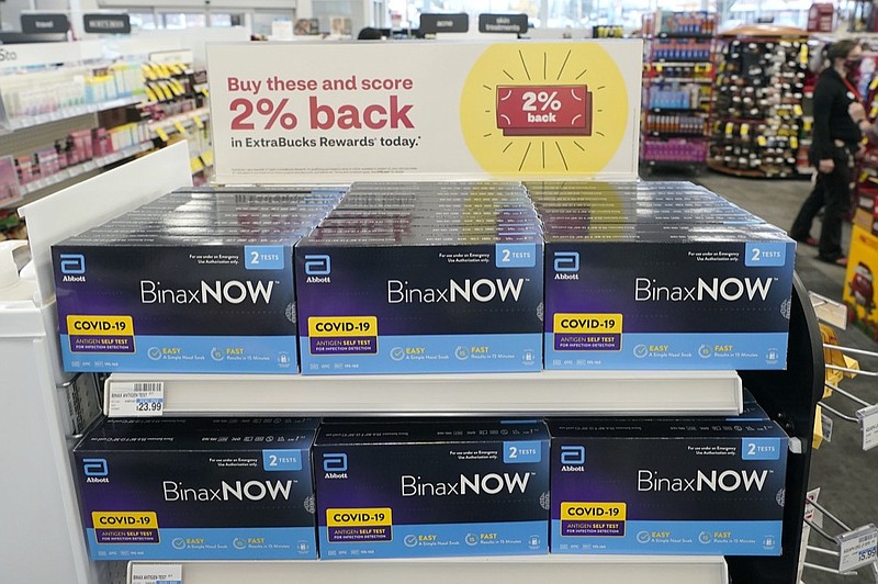 Boxes of BinaxNow home COVID-19 tests made by Abbott are shown for sale Monday, Nov. 15, 2021, at a CVS store in Lakewood, Wash., south of Seattle. (AP Photo/Ted S. Warren)


