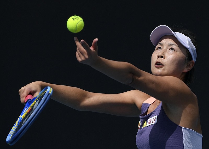 FILE - China's Peng Shuai serves to Japan's Nao Hibino during their first round singles match at the Australian Open tennis championship in Melbourne, Australia, on Jan. 21, 2020. (AP Photo/Andy Brownbill, File)


