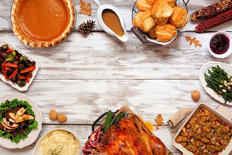 Classic Thanksgiving turkey dinner with side dishes. / Getty Images/iStock/jenifoto