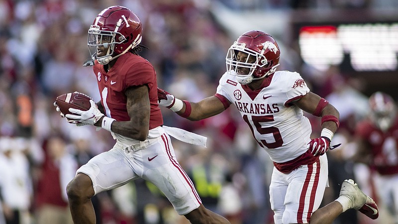 AP photo by Vasha Hunt / Alabama wide receiver Jameson Williams runs past Arkansas defensive back Simeon Blair to score a touchdown during the first half of Saturday's game in Tuscaloosa, Ala.
