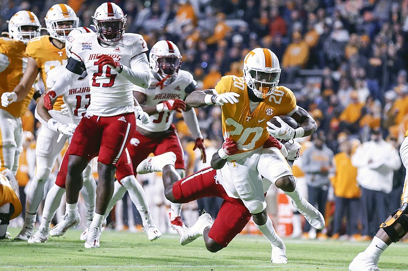 AP photo by Wade Payne / Tennessee running back Jaylen Wright escapes the grasp of South Alabama defensive lineman Charles Coleman III to run for a touchdown during the first half of Saturday night's game in Knoxville.