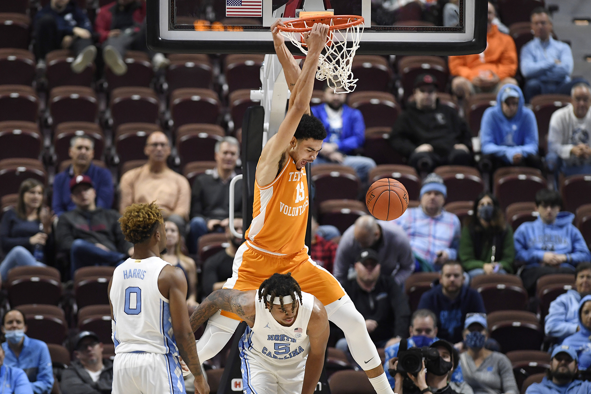 AP photo by Jessica Hill / Tennessee's Olivier Nkamhoua dunks over North Carolina's Armando Bacot in the second half of the consolation game of the Hall of Fame Tip-Off Tournament on Sunday in Uncasville, Conn.