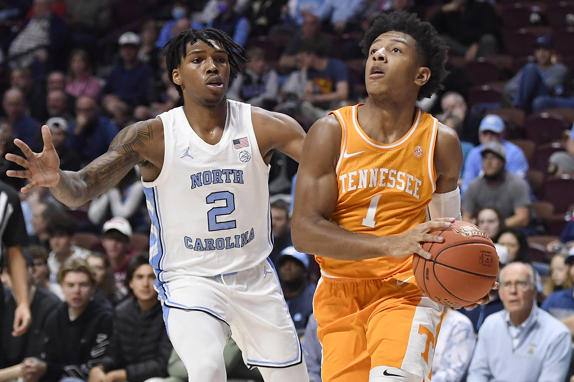 AP photo by Jessica Hill / Tennessee point guard Kennedy Chandler drives past North Carolina's Caleb Love during the consolation game of the Hall of Fame Tip-Off Tournament on Sunday in Uncasville, Conn.