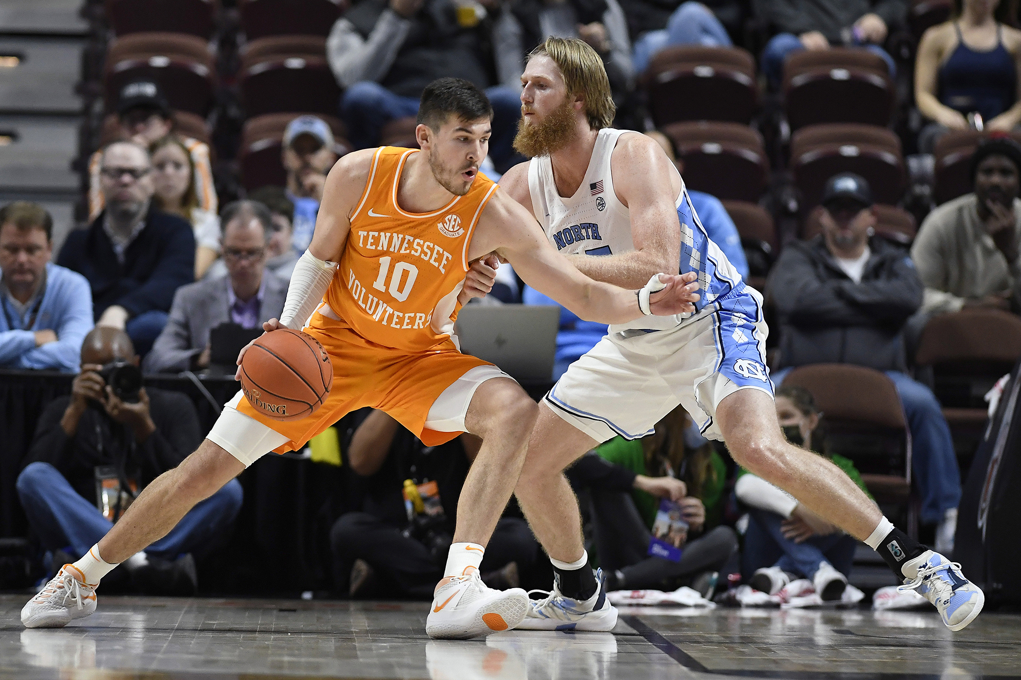 AP photo by Jessica Hill / Tennessee's John Fulkerson (10) is guarded by North Carolina's Brady Manek during the consolation game of the Hall of Fame Tip-Off Tournament on Sunday in Uncasville, Conn.