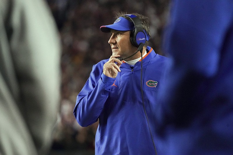 AP photo by Sean Rayford / Dan Mullen watches from the sideline while coaching Florida during its loss at South Carolina on Nov. 6. Florida fired Mullen on Sunday with the regular-season finale remaining in his fourth year as coach and five full seasons remaining on his contract.
