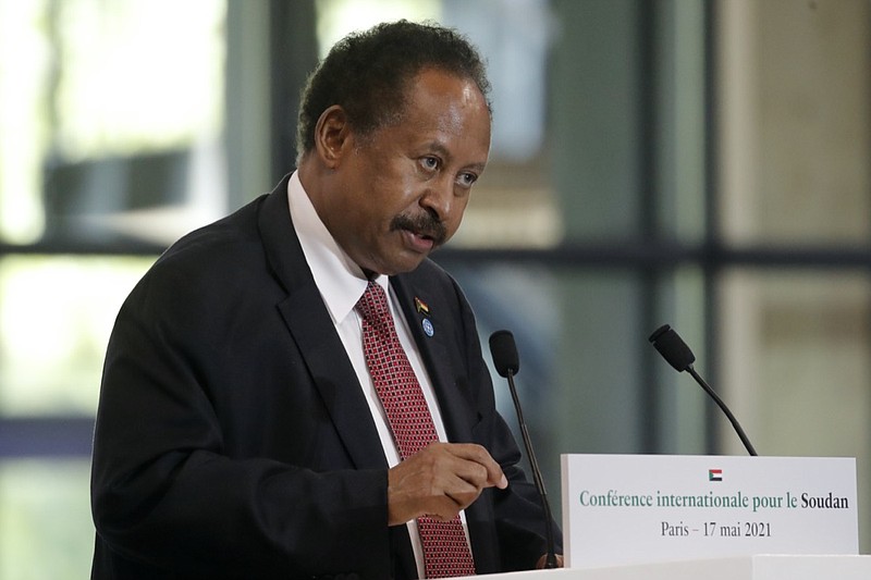 FILE - Sudanese Prime Minister Abdalla Hamdok speaks during a session of the summit to support Sudan, May 17, 2021 at the Grand Palais Ephemere in Paris. On Sunday, Nov. 21, 2021, Sudan's military and civilian leaders signed a deal to reinstate Prime Minister Abdalla Hamdok, who was deposed in a coup last month. According to the deal, the military will also release government officials and politicians arrested since the Oct. 25 coup. The country's top general, Abdel Fattah Burhan, said Hamdok will lead an independent technocratic Cabinet until elections can be held. (AP Photo/Christophe Ena, Pool, File)