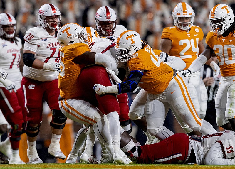 Tennessee Athletics photo by Andrew Ferguson / Tennessee defensive linemen Da'Jon Terry (95) and Ja'Quain Blakely (48) wrap up South Alabama quarterback Desmond Trotter last Saturday night in Neyland Stadium. Blakely will play his final home game for the Volunteers this weekend against Vanderbilt.