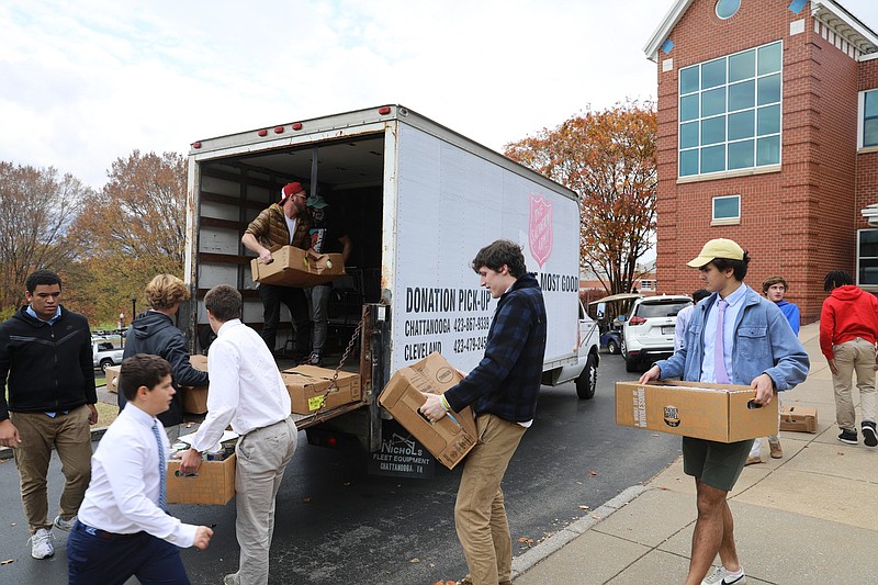 Contributed photo / McCallie middle and high school students pack boxes of donated Thanksgiving foods into The Salvation Army's truck. The food was distributed to 75 families and individuals in our area.