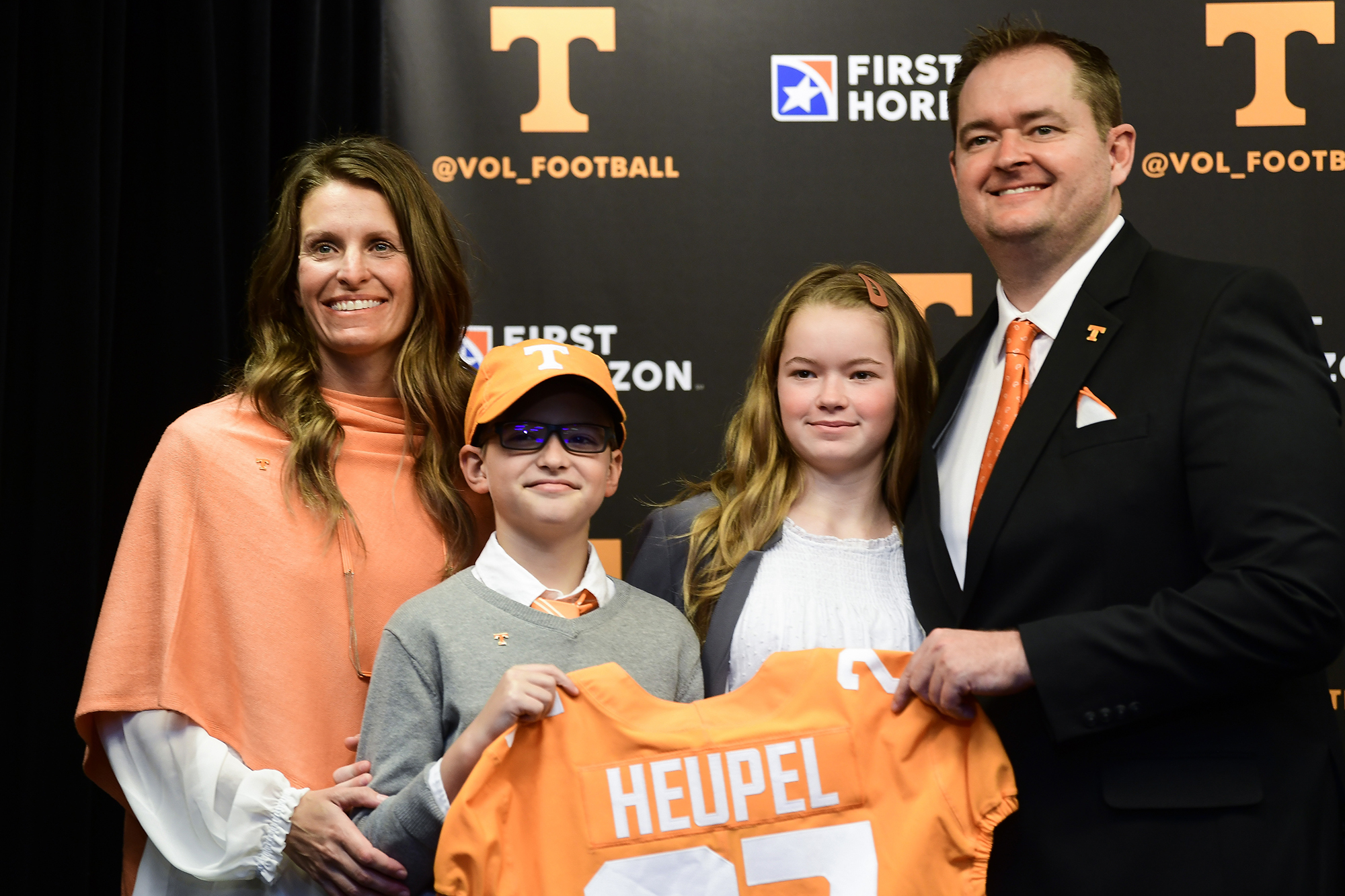 Knoxville News Sentinel photo by Caitie McMekin via AP / Tennessee football Josh Heupel poses with his wife Dawn, son Jace and daughter Hannah after his introductory news conference on Jan. 27 at Neyland Stadium in Knoxville.