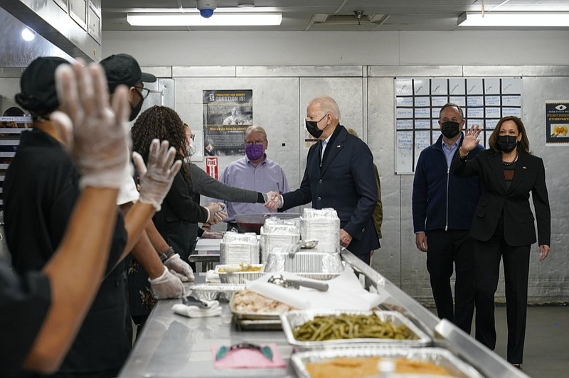 President Joe Biden, first lady Jill Biden, Vice President Kamala Harris, and second gentleman Doug Emhoff, arrive to assemble Thanksgiving meal kits during a visit to DC Central Kitchen in Washington, Tuesday, Nov. 23, 2021. (AP Photo/Susan Walsh)


