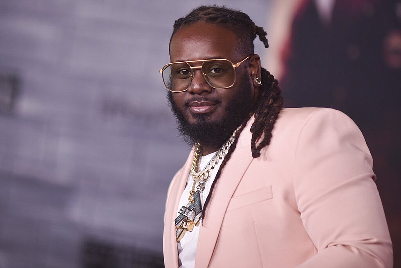 T-Pain attends the LA premiere of "Bad Boys for Life" on Jan. 14, 2020, in Los Angeles. T-Pain's new book, "Can I Mix You a Drink?" co-written with professional cocktail expert Maxwell Britten, is filled with 50 alcoholic drink recipes inspired by Pain's music and career travels. (Photo by Richard Shotwell/Invision/AP, File)