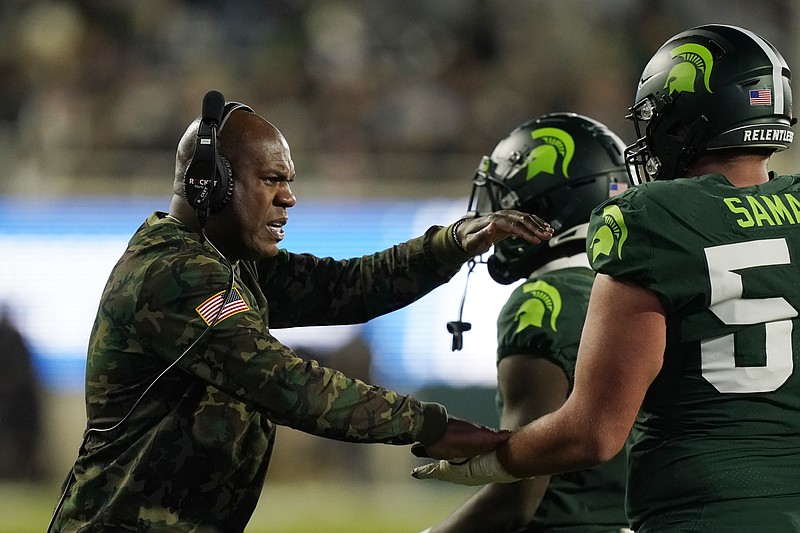 AP photo by Carlos Osorio / Michigan State football coach Mel Tucker talks to his players during a Big Ten game against Maryland on Nov. 13, in East Lansing, Mich.