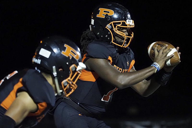 Staff file photo by C.B. Schmelter / South Pittsburg quarterback Richard Hunter, right, has provided senior leadership and a passing element that has offered balance to the Pirates' ground-based attack this season. South Pittsburg (9-2) will visit Cloudland (12-1) on Friday night in the TSSAA Class 1A state semifinals.