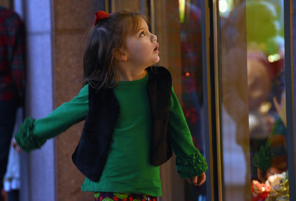 Staff Photo by Matt Hamilton / Isabelle Shrader, 4, looks through the windows at EPB headquarters on Wednesday, November 24, 2021.