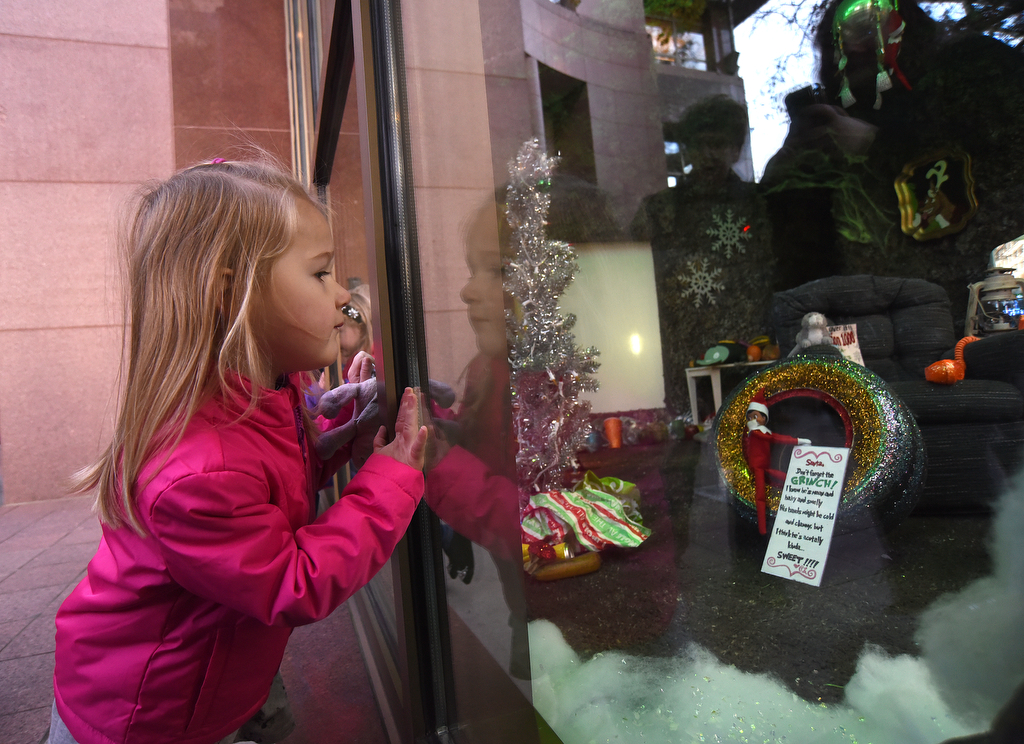 Staff Photo by Matt Hamilton / Cara Collins, 3, looks through the windows at EPB headquarters on Wednesday, November 24, 2021.