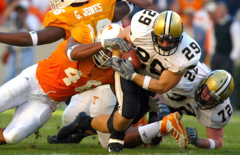 Vanderbilt photo by Neil Brake / Vanderbilt fullback Clark Lea looks for extra yardage during a 48-0 loss at Tennessee in 2003. Lea is now in his first season as head coach of the Commodores, who visit the Volunteers on Saturday.