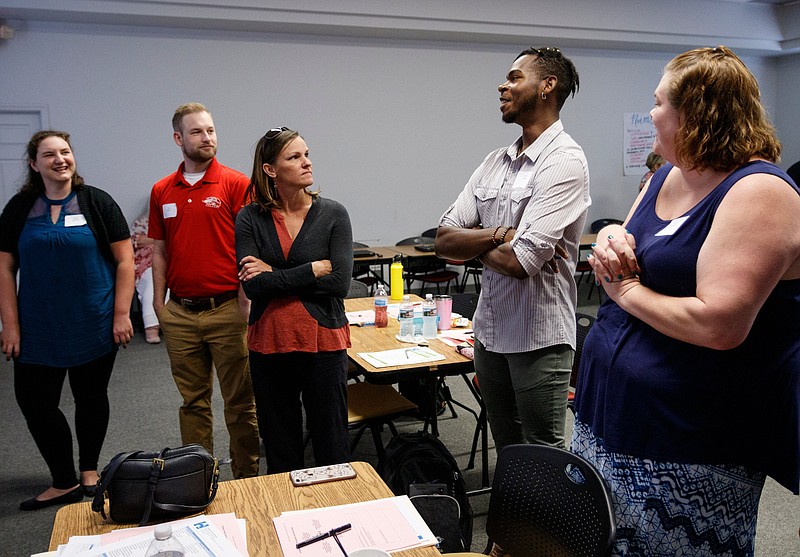 Staff photo by Doug Strickland / Educators participate in an icebreaker during a new hire orientation at Hamilton County Schools Central Office on Wednesday, July 10, 2019, in Chattanooga, Tenn.