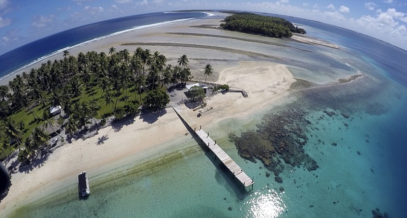 FILE - An aerial photo shows a small section of the atoll that has slipped beneath the water line only showing a small pile of rocks at low tide on Majuro Atoll in the Marshall Islands on Nov. 8, 2015. (AP Photo/Rob Griffith, File)


