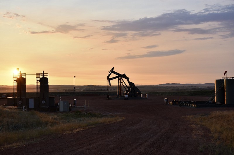 FILE - An oil well works at sunrise Aug. 25, 2021, in Watford City, N.D., part of McKenzie County. (AP Photo/Matthew Brown, File)


