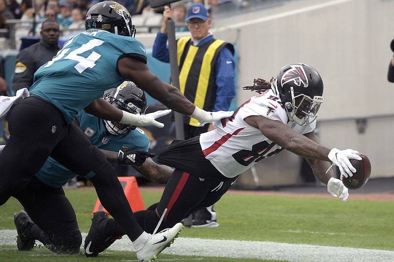 AP photo by Phelan M. Ebenhack / Atlanta Falcons running back Cordarrelle Patterson dives for a touchdown past Jacksonville Jaguars linebacker Myles Jack (44) during the first half of Sunday's game in Jacksonville, Fla. Patterson returned from an ankle injury to rush for 108 yards and two scores as the Falcons beat the Jaguars 21-14.