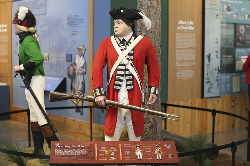 A exhibit of a British soldier is displayed at the Revolutionary War Visitor Center, Friday, Sept. 24, 2021, in Camden, S.C. The center was opened this year to capitalize on the upcoming 250th anniversary of the war as South Carolina promises to tell the full story of its role from the Founding Fathers to slavery. (AP Photo/Jeffrey Collins)