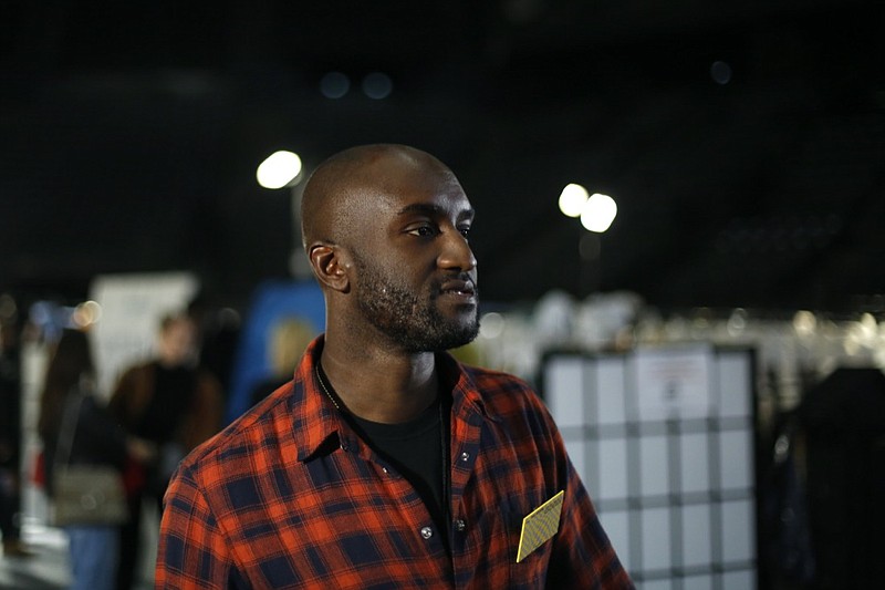 FILE - Designer Virgil Abloh walks backstage prior to his Off-White ready to wear Fall-Winter 2019-2020 collection, that was presented in Paris, Thursday, Feb. 28, 2019. Abloh, a leading fashion executive hailed as the Karl Lagerfeld of his generation, has died after a private battle with cancer. He was 41. Abloh's death was announced Sunday, Nov. 28, 2021 by LVMH Louis Vuitton and the Off White label, the brand he founded. (AP Photo/Thibault Camus, File )