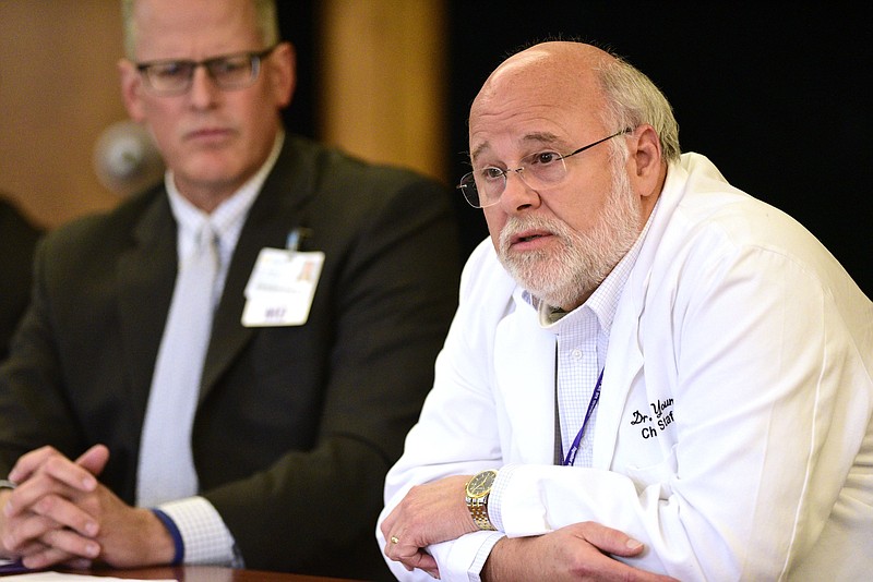 Staff file photo by Robin Rudd / Former Erlanger Chief of Staff Dr. Chris Young, right, in June praises the hospital's staff's performance during the COVID-19 pandemic. The Erlanger Board of Trustees in October voted 6-3 to oust Young.