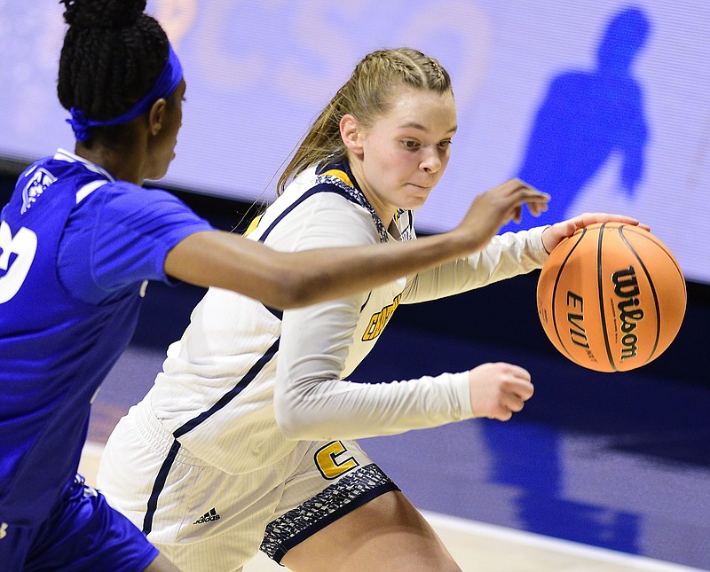 Staff Photo by Robin Rudd / UTC's Sigrun Olafsdottir (5) moves the ball.  The UTC Mocs hosted the Georgia State Panthers in Women's Basketball, at McKenzie Arena, on November 27, 2021.