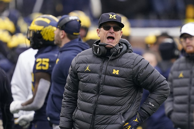 Michigan head coach Jim Harbaugh yells from the sideline during the second half of an NCAA college football game against Ohio State, Saturday, Nov. 27, 2021, in Ann Arbor, Mich. (AP Photo/Carlos Osorio)