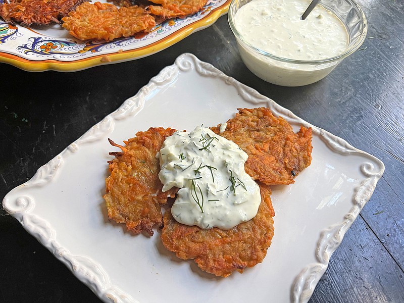 Mexican chef Pati Jinich gives her sweet potato and apple Hanukkah latkes some ethnic flair with a fennel Mexican crema. / Photo by Gretchen McKay/Pittsburgh Post-Gazette/TNS