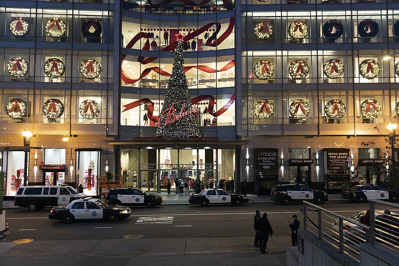 New York Times photo by Jason Henry / A heavy police presence in the Union Square shopping area as Black Friday shopping begins in San Francisco. There were "smash-and-grab" robberies at several San Francisco retailers this month.