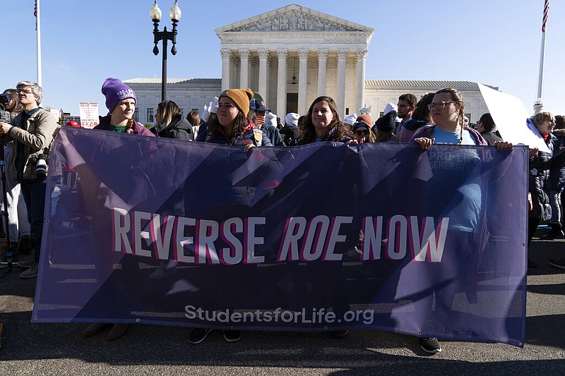 Anti-abortion protesters demonstrate in front of the U.S. Supreme Court Wednesday, Dec. 1, 2021, in Washington, as the court hears arguments in a case from Mississippi, where a 2018 law would ban abortions after 15 weeks of pregnancy, well before viability. (AP Photo/Jose Luis Magana)