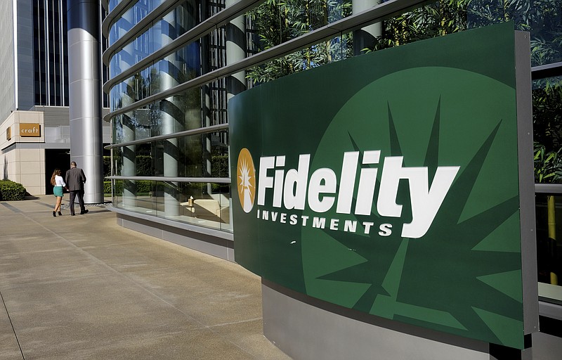 FILE - A sign outside of a Fidelity Investments office in the Century City section of Los Angeles is shown June 16, 2016. Cash management accounts are offered by brokerages and provide many banking-like services, such as checking and savings. Joel Parker, a financial blogger and podcaster from Massachusetts, has a Fidelity Cash Management Account and appreciates the speed of transfers that would otherwise take between one and three days from a non-Fidelity account. (AP Photo/Richard Vogel, File)