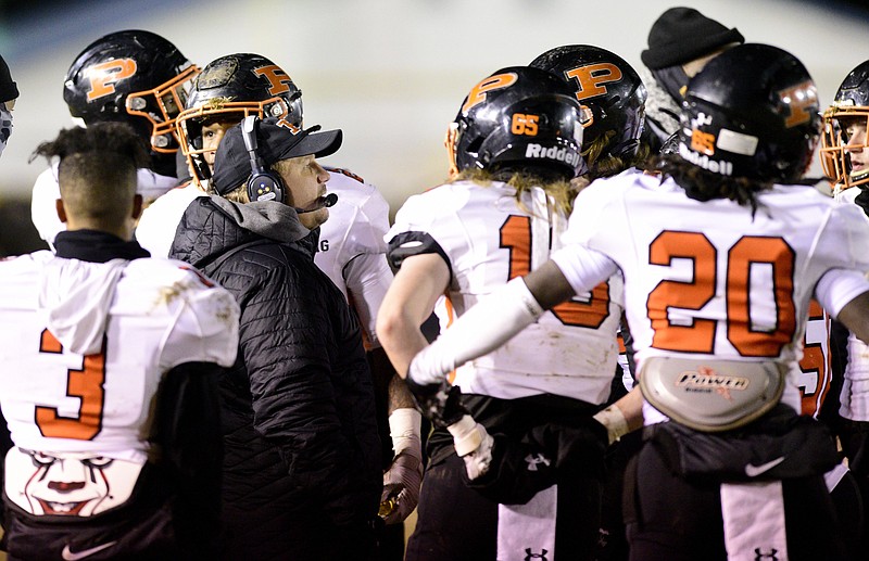 Staff photo by Robin Rudd / South Pittsburg High School football co-head coach Wes Stone gathers players around him during the Pirates' TSSAA Class 1A semifinal last Friday night against Cloudland in Roan Mountain, Tenn.