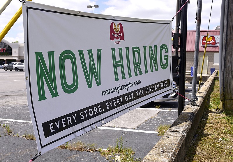 Staff file photo by Robin Rudd / The Marco's Pizza, in East Brainerd, has had a "now hiring" sign out front. Employers in the Chattanooga area still are having a difficult time attracting workers to entry level jobs.