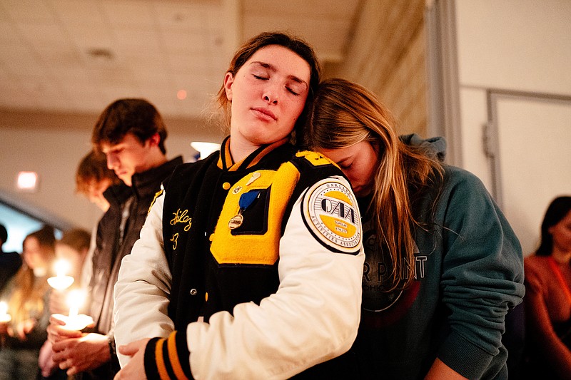 New York Times photo by Nick Hagen / Oxford High School students gather at a candlelight vigil in Michigan after a fellow student at the school this week fatally shot four and injured seven.