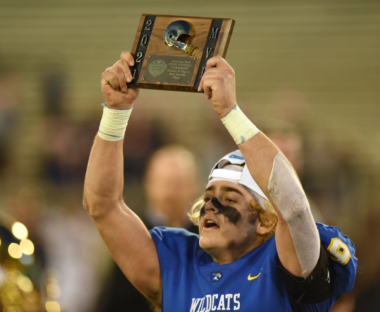 Staff Photo by Matt Hamilton / Donelson Christian Academy (9) Jacob Cook celebrates after receiving his most valuable player award on Thursday, December 2, 2021 at Finley Stadium. Nashville Christian School and Donelson Christian Academy played in the Division II Class A state championship game Thursday.