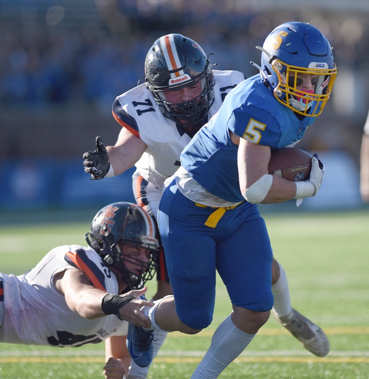 Staff Photo by Matt Hamilton / Donelson Christian Academy (5) Ashton Jones carries the ball as Nashville Christian School (71) Aiden Humes and (45) Jaden Potts defend on Thursday, December 2, 2021 at Finley Stadium. Nashville Christian School and Donelson Christian Academy played in the Division II Class A state championship game Thursday.