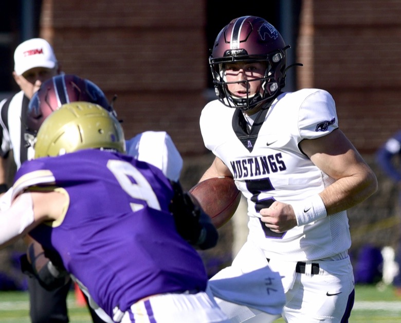 Staff Photo by Robin Rudd / Lipscomb quarterback Luther Richesson (5) picks up yards around right end. The Lipscomb Academy Mustangs defeated the Christ Presbyterian Academy Lions 27 to 0 to win the TSSAA Division II Class AA state football championship in the BlueCross Bowl held at Finley Stadium.