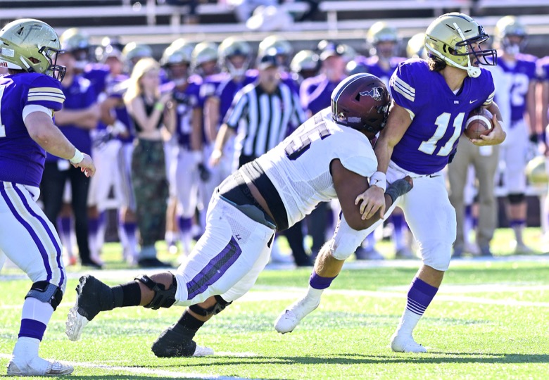 Staff Photo by Robin Rudd / Lipscomb's Chauncey Gooden (55) sacks CPA quarterback Cade Law (11). The Lipscomb Academy Mustangs defeated the Christ Presbyterian Academy Lions 27 to 0 to win the TSSAA Division II Class AA state football championship in the BlueCross Bowl held at Finley Stadium.
