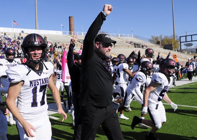 Staff Photo by Robin Rudd / Lipscomb head coach Trent Dilfer leads the Mustangs onto the field as time runs out. The Lipscomb Academy Mustangs defeated the Christ Presbyterian Academy Lions 27 to 0 to win the TSSAA Division II Class AA state football championship in the BlueCross Bowl held at Finley Stadium.