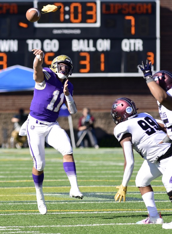 Staff Photo by Robin Rudd / Cade Law (11) throws a pass for the Lions. The Lipscomb Academy Mustangs defeated the Christ Presbyterian Academy Lions 27 to 0 to win the TSSAA Division II Class AA state football championship in the BlueCross Bowl held at Finley Stadium.
