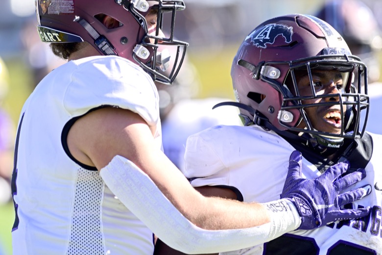 Staff Photo by Robin Rudd / Lipscomb's Alexander Broome (20) is congratulated by a teammate after scoring a touchdown. The Lipscomb Academy Mustangs defeated the Christ Presbyterian Academy Lions 27 to 0 to win the TSSAA Division II Class AA state football championship in the BlueCross Bowl held at Finley Stadium.