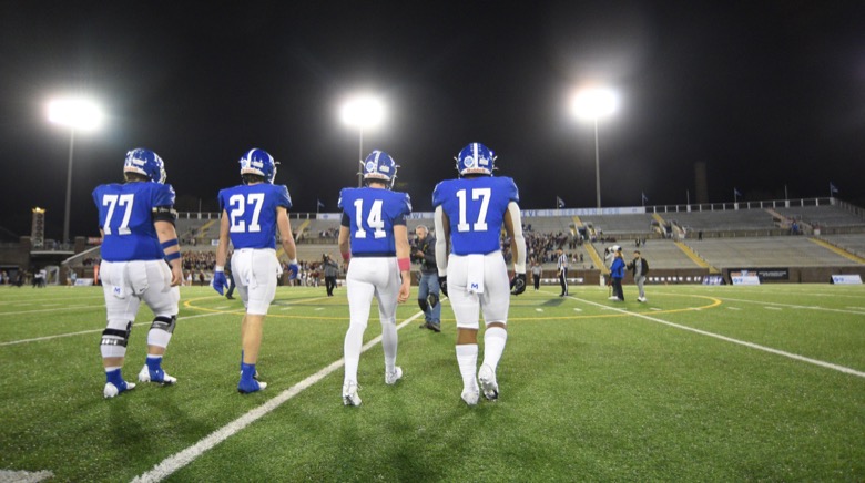 Staff Photo by Matt Hamilton / McCallie School team captains walk out to the coin toss on Thursday, December 2, 2021 at Finley Stadium. McCallie School played Montgomery Bell Academy in the Division II Class AAA State Football Playoffs on Thursday.