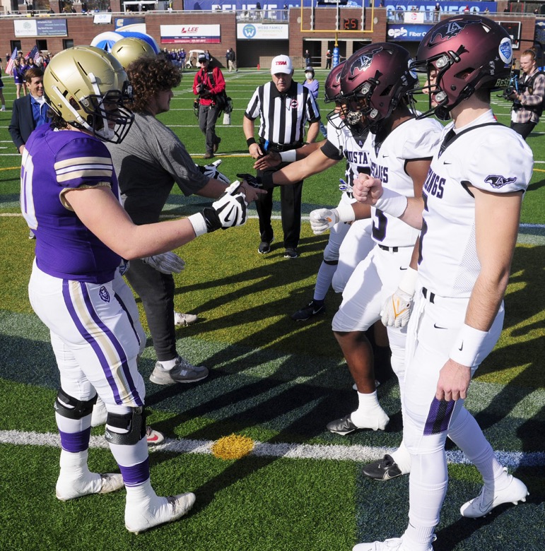 Staff Photo by Robin Rudd / The captains meet at midfield for the coin toss. The Lipscomb Academy Mustangs defeated the Christ Presbyterian Academy Lions 27 to 0 to win the TSSAA Division II Class AA state football championship in the BlueCross Bowl held at Finley Stadium.